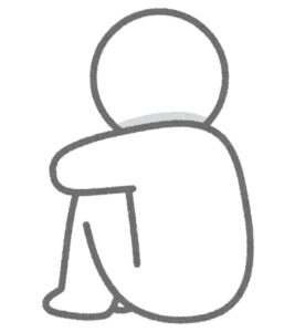 体育座りした人の後ろ姿のイラす